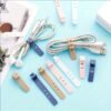 eeffd990-c5a7-4147-902a-da72094ef49f.jpg 2-Piece Reusable Silicone Cable Organizer Ties